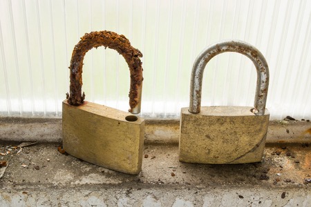 A pair of forgotten locks in the window frame remind us of someone who forgot the keys somewhere ...の写真素材