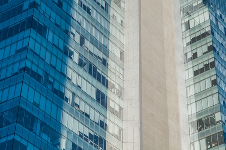 Detail of an office and business building with blue and turquoise windows on the South Insurgentes...