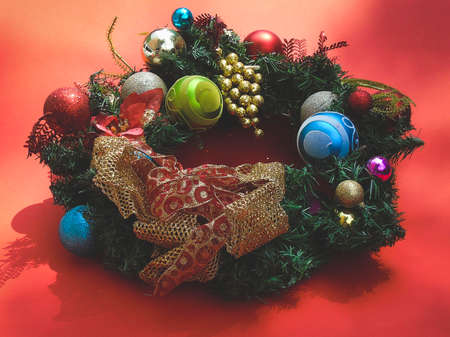 Christmas wreath on a red backgroundの写真素材