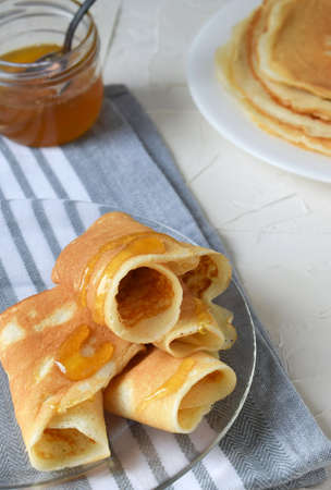 pancakes rolled into a tube with honeyの写真素材