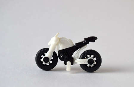 a small children's toy motorcycle in black and white.