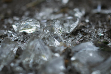 background of broken glass fragments macro. unusual abstract photographyの写真素材