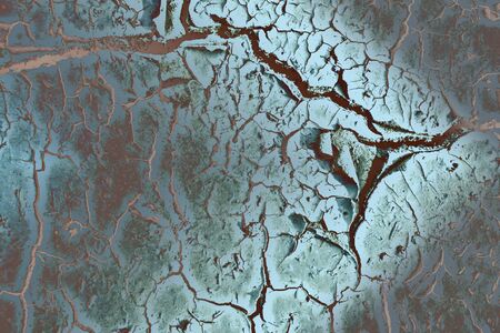 cracked dry earth painted blue gray with brown cracks, top view