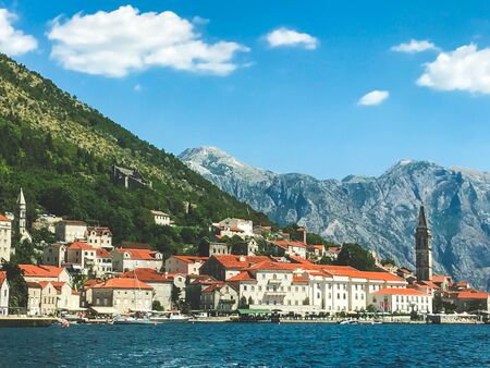 Panorama of the historic town of Perast in the Bay of Kotor on a beautiful sunny day with blue sky and clouds in summer. Montenegro Southern Europe. summer 2019の写真素材