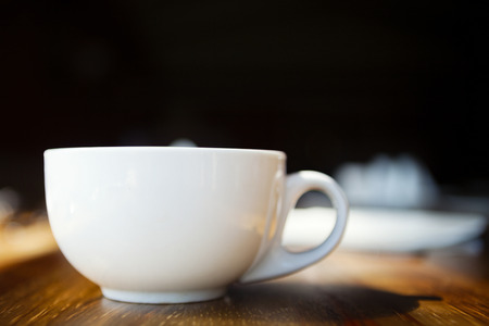 Coffee cup, on wooden table.の写真素材