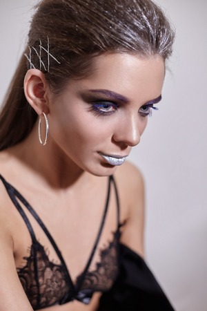 Portrait of a young sexual girl in black lingerie.の写真素材