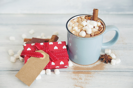 Hot chocolate with marshmallow and gift boxの写真素材