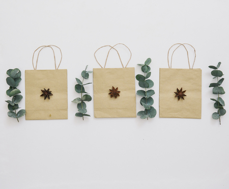 Flat lay composition. Paper bag with leavesの写真素材
