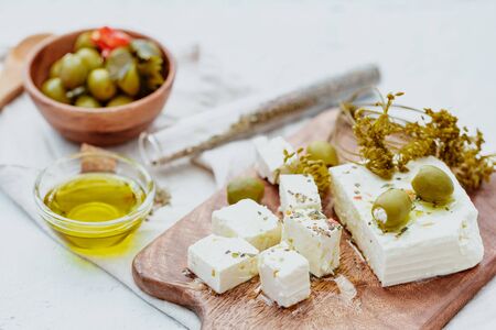 Fresh feta cheese with herbsの写真素材