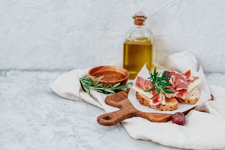 Spanish ham with toasts,rosemay,garlic and olive oilの写真素材