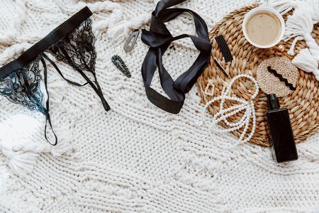 Lifestyle Fashion trendy women's underwear composition. Bra,  coffee, on wool blanket, Flat lay, top...