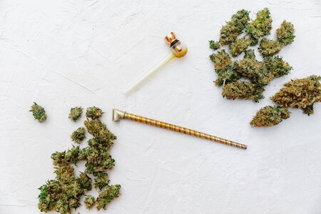 Medical marijuana buds on white background. Therapeutic and medical cannabis. Top view, flat lay, copy space の写真素材