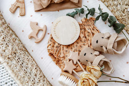 Flat lay composition with cute baby items in basket. The concept of awaiting baby, pregnancyの写真素材