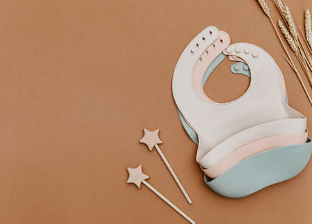 Set of silicone bibs for baby. First baby food concept, serving food for kidsの写真素材