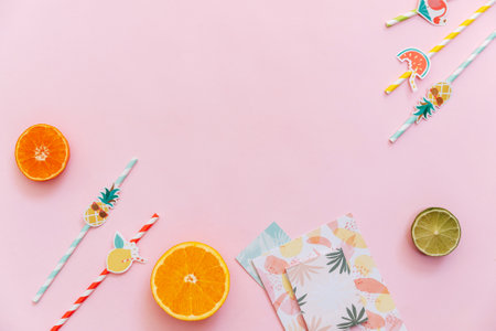 Flat Lay Summer tropical background. Workspace with supplies and fresh fruits. Top view, copy spaceの写真素材