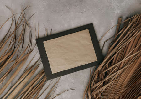 Stylish mock up of dry palm leaves. Moody minimal invitation concept. Still life photo
