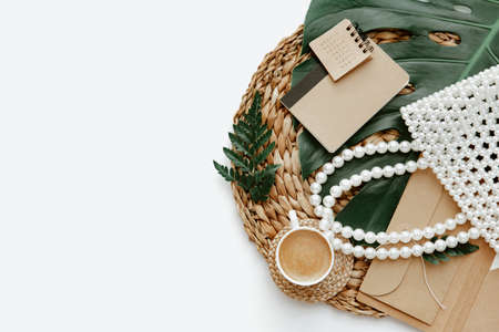 Summer Flat lay workspace with cup of coffee and notes. Ideas, notes or plan writing concept. Minimal eco friendly blogger. Zero wasteの写真素材