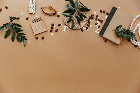 Stylish background with cup of coffee, calendar and notes on brown. Ideas, notes or plan writing concept. Minimal eco friendly blogger. Zero wasteの写真素材