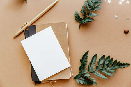Brown blogger background with note and blank card. Todo list, planning concept, mock up