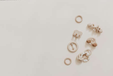 Baby wooden toy eco natural. Scandinavian nordic style on beige background. Mockup. Top view. Copy...