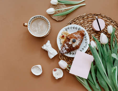 Greetings card, Spring composition. White tulips and candle on brown background. Mother day, March...