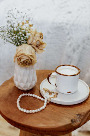 Coffee cup cappuccino, vintage dried flowers, cozy home. Hygge, Lagom, Moody. Cozy autumn winter...