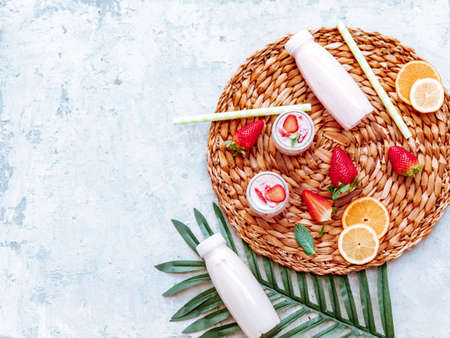 Top view olive oil, olives, toast bread and leaves on white background, space for textの写真素材