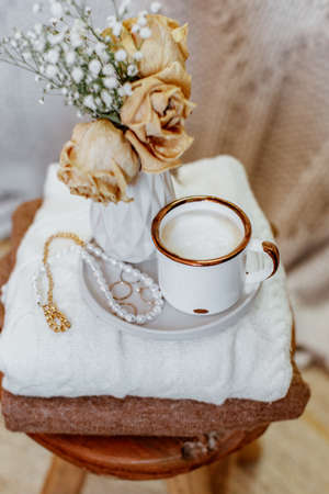 Coffee cup cappuccino, vintage dried flowers, cozy home. Hygge, Lagom, Moody. Cozy autumn winter conceptの写真素材