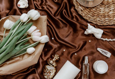 Flat lay fashion collage with women accessories. Bouquet of spring white tulips .The concept of...