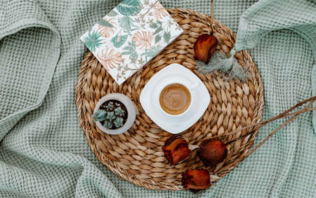Home flat lay with coffee cup and dried roses. Notebook, succulent. Lifestyle blogger concept,...