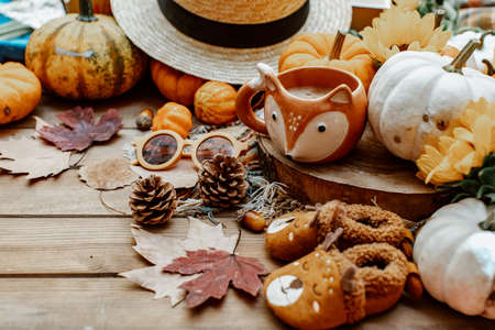 Autumn creative composition made of pumpkins, dried leaves. Autumn, fall concept. Flat lay, top view.の写真素材