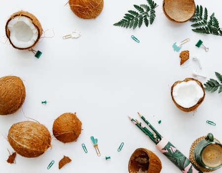Flat lay coconuts on white background, office suppliesの写真素材
