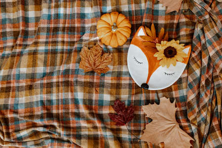 Autumn background decoration from dry leaves and pumpkin on dark wooden background. Flat lay, top view for Autumn, fall, Thanksgiving concept.の写真素材