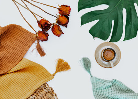 Autumn flat lay, coffee with monstera leaves, blankets on a white background. Cozy fall still life. View from above. Flat lay.の写真素材