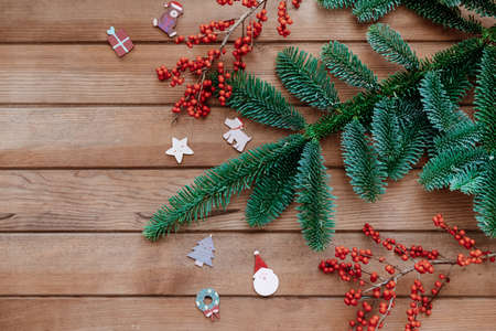 Christmas background. Green fir tree branches on wooden background. Christmas background, Christmas festive still life, festive Christmas background, free space for Christmas textの写真素材