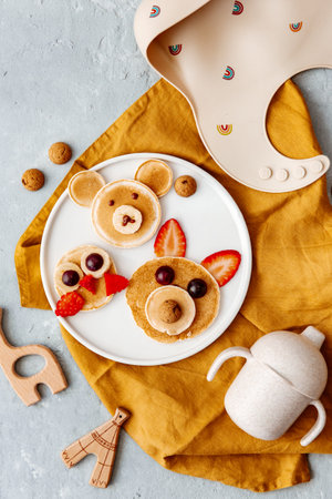 Animal Shaped Pancake with strawberry and fruit for kids. Plate with funny pancake. Funny breakfast idea for children. Kids meal. flat layの写真素材
