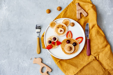 Colorful breakfast meal for kids. Funny Easter food art, top view. Concept of healthy eating, baby food, healthy breakfast foodの写真素材