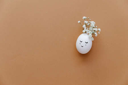 Simple Easter eggs on pastel background. Happy Easter aesthetic. Festive flat lay greeting card banner. copy spaceの写真素材