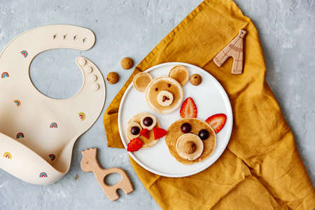 Animal Shaped Pancake with strawberry and fruit for kids. Plate with funny pancake. Funny breakfast idea for children. Kids meal. flat layの写真素材