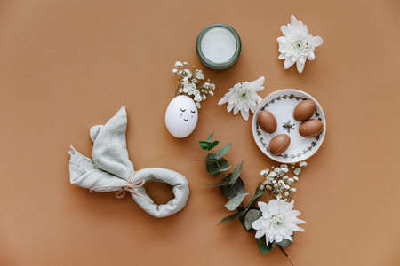 Easter holiday with bunny from egg. Aesthetic Happy Easter background. Spring holiday top view flat layの写真素材