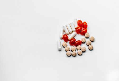 pills of different colors and composition
