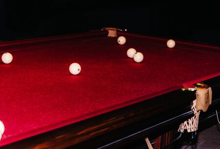 pool table with red textile cover. competition tournament party. billiard ball