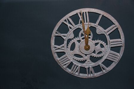 Vintage metal heavy round hour with roman numerals, rarity antiques. interior element decor