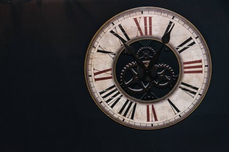 Vintage metal heavy round hour with roman numerals, rarity antiques. interior element decor