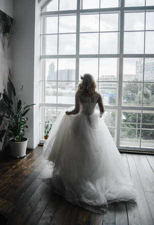 young slender bride in a long white elegant wedding dress. honeymoon ceremonyの写真素材