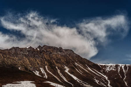mountains of georgia gudaugi mountain peaks ridges in the snow in the green
