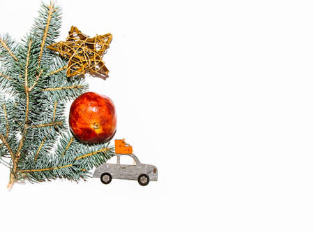 layout white background blue spruce branch Christmas toys balls machine with gifts star from the gotangの写真素材