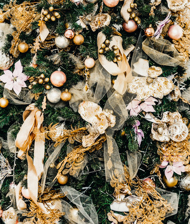 beautiful big Christmas tree decorated with balls and toys holiday christmas mood gifts with ribbons.の写真素材