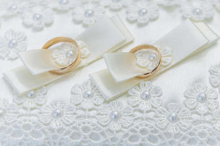 hands of young people with wedding wedding rings. wedding day details. calla flowers. spouses newlyweds groom and brideの写真素材