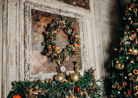 beautiful big Christmas tree decorated with balls and toys holiday christmas mood gifts with ribbons.の写真素材